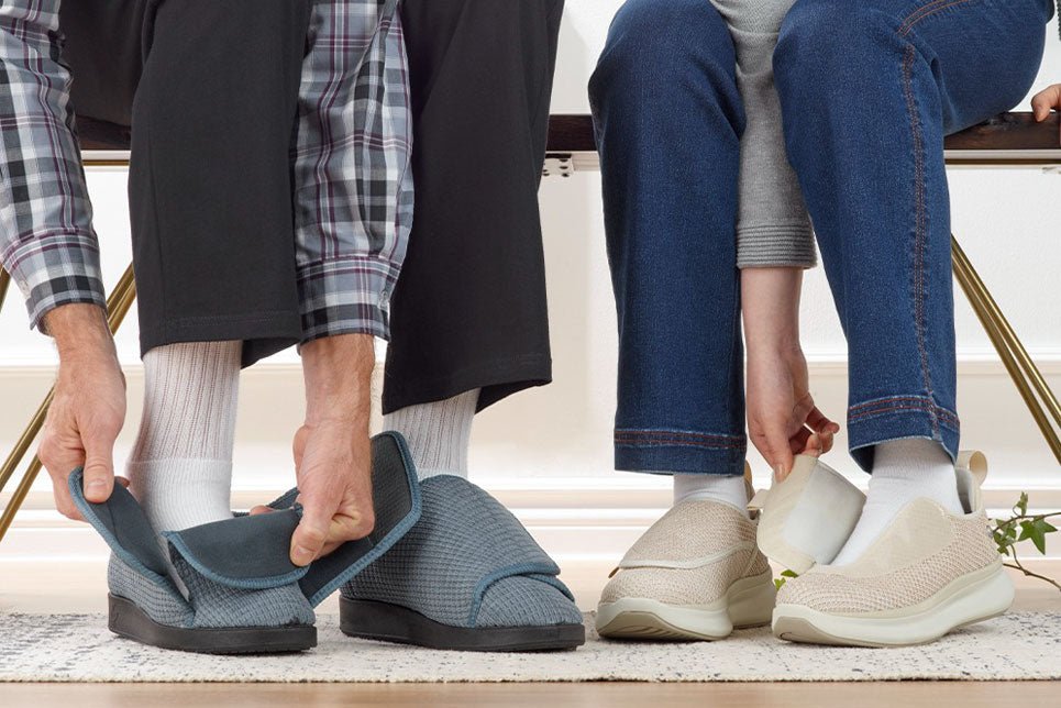 Two people put on Silverts slippers