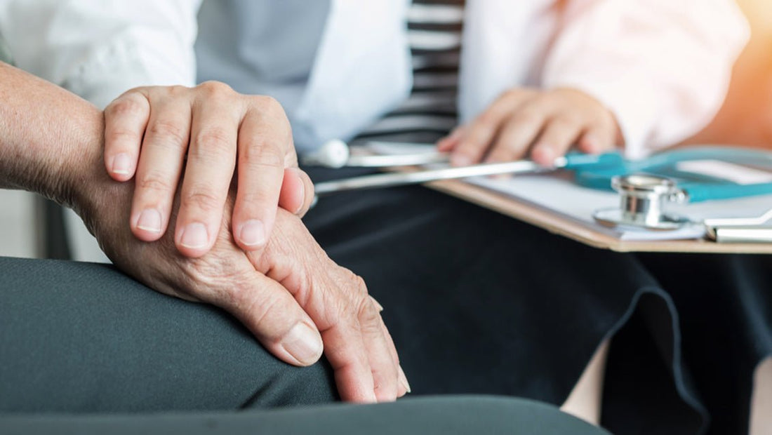 a doctor comforting a senior patient