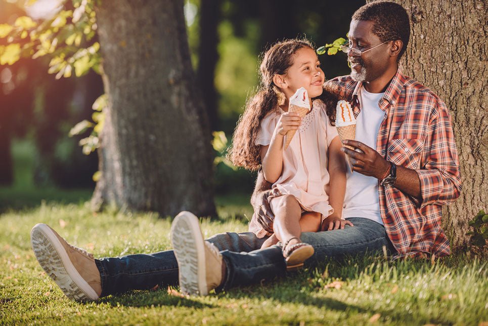 grandfather and granddaughter eating ice cream