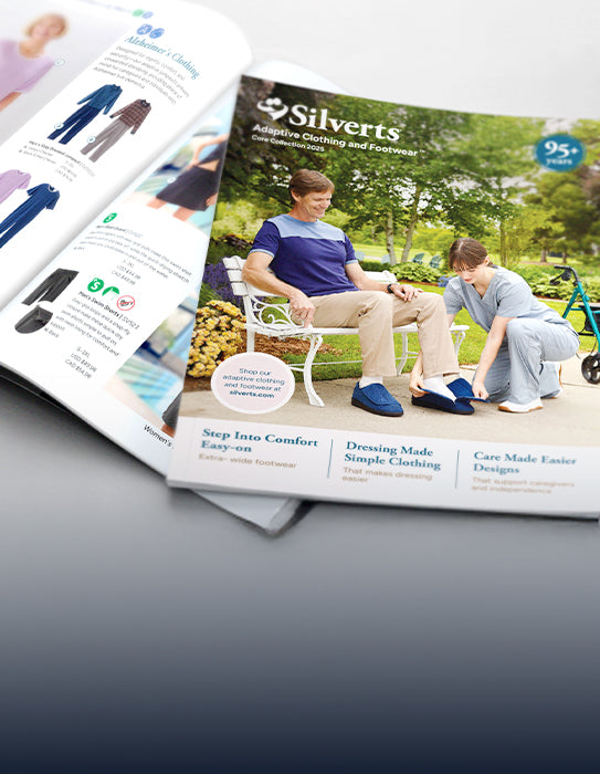 Open Silverts adaptive clothing catalog featuring adaptive apparel and footwear, with a caregiver helping an older adult put on adaptive slippers on the cover.