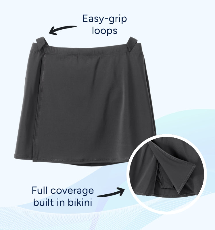 Black skirt with easy-grip loops and full coverage built-in bikini on a light blue background