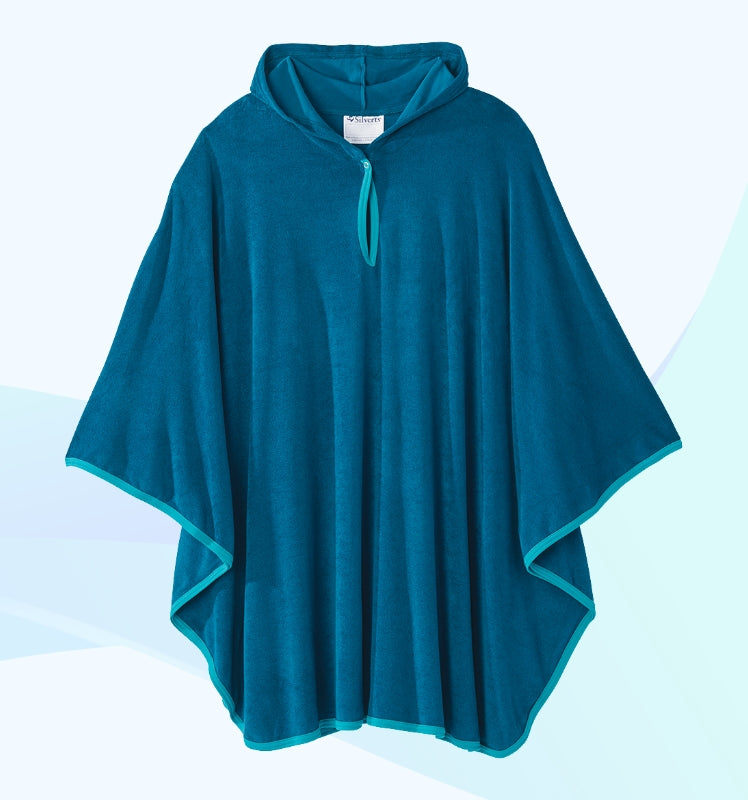 Teal hooded poncho on a light blue background