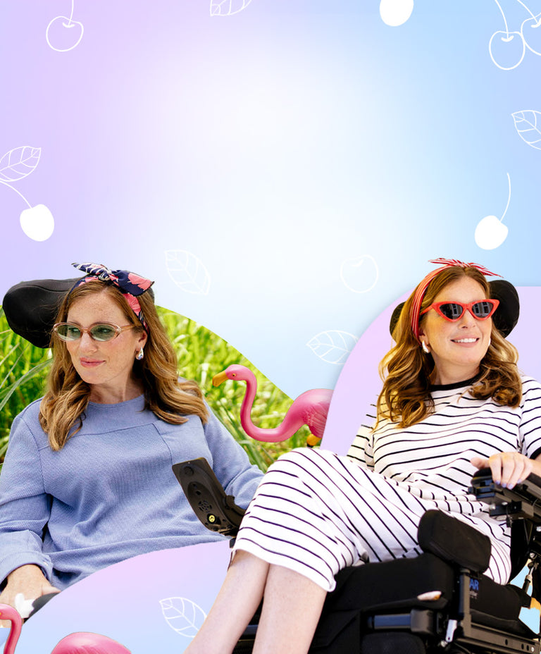 Two women in wheelchairs with decorative hats and sunglasses against a colorful background with flamingos and cherries.